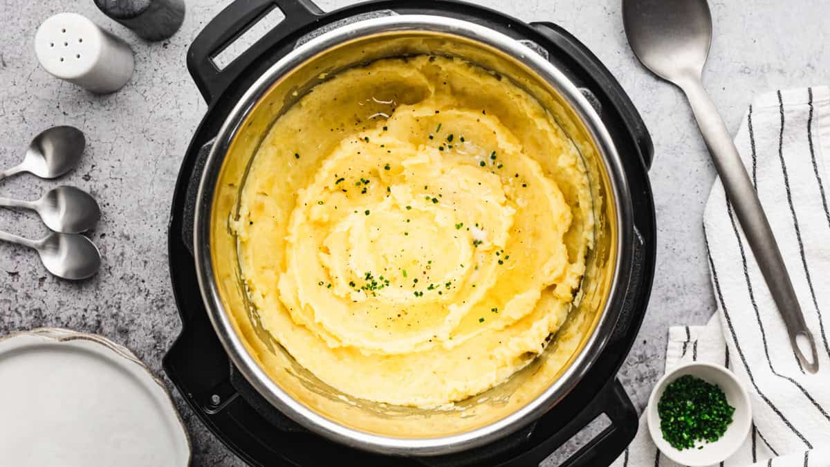 These easy Instant Pot Mashed Potatoes are a true "set it and forget it" recipe, all made in one pot in just 30 minutes. They are creamy, flavorful, and perfect for holidays or to pair with any entree!
