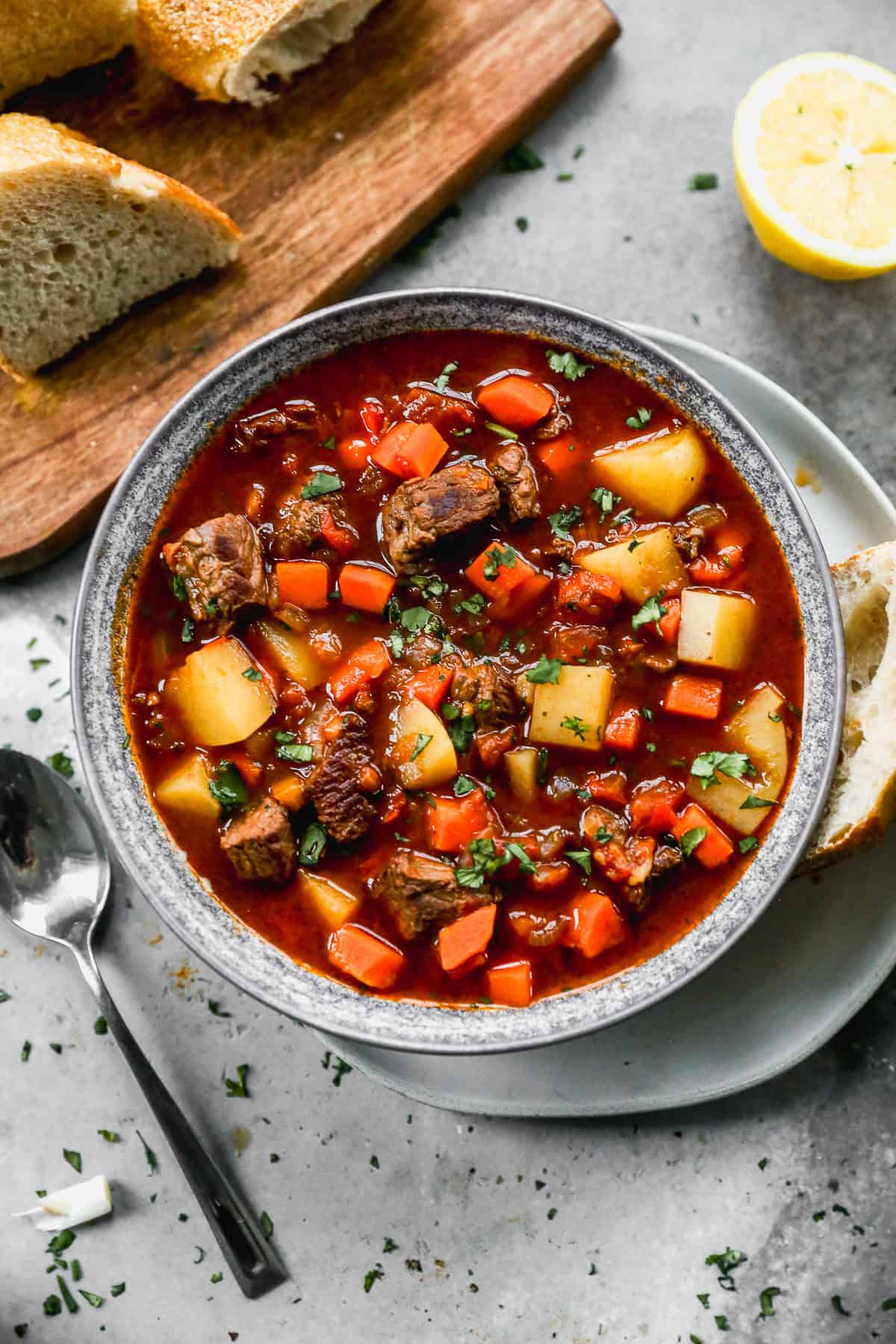 A traditional Hungarian Goulash recipe served in a bowl with a side of crusty bread.