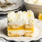 A piece of an easy lemon tiramisu dessert on a white plate, showing the delicious layers.