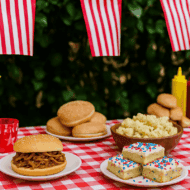 Fourth of july table with pulled pork , sugar cookie bars, and mac salad.