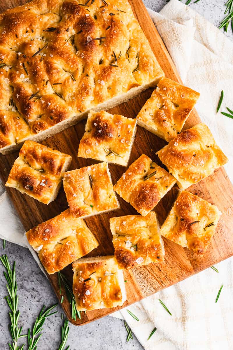 A close up image of an Italian Focaccia recipe baked until golden and sprinkled with flake salt.