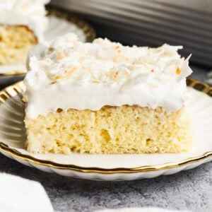 The best Coconut Tres Leches Cake has a fluffy sponge cake with a coconut milk twist and topped with whipped cream and coconut flakes. It's the perfect light dessert!
