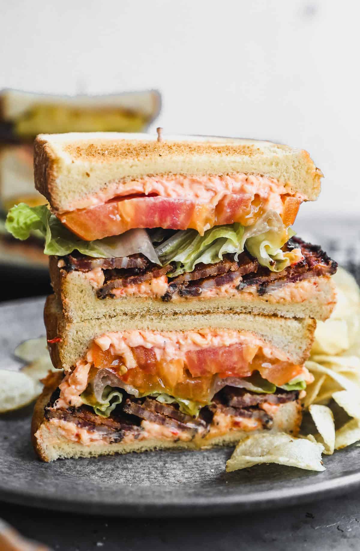 A Pimento Cheese BLT instantly elevates the classic sandwich by spreading homemade pimento cheese on the bread, bringing the perfect creamy flavor punch. 