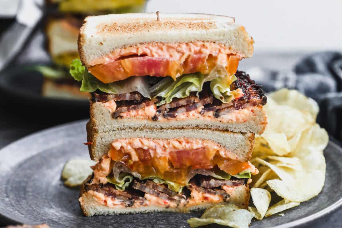 A Pimento Cheese BLT instantly elevates the classic sandwich by spreading homemade pimento cheese on the bread, bringing the perfect creamy flavor punch. 