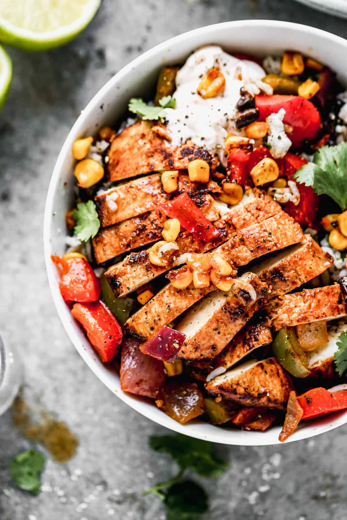 Seasoned chicken, tender peppers, and onions with rice and toppings make these fajita bowls a bold, satisfying dinner thatโs fast enough for any night of the week.