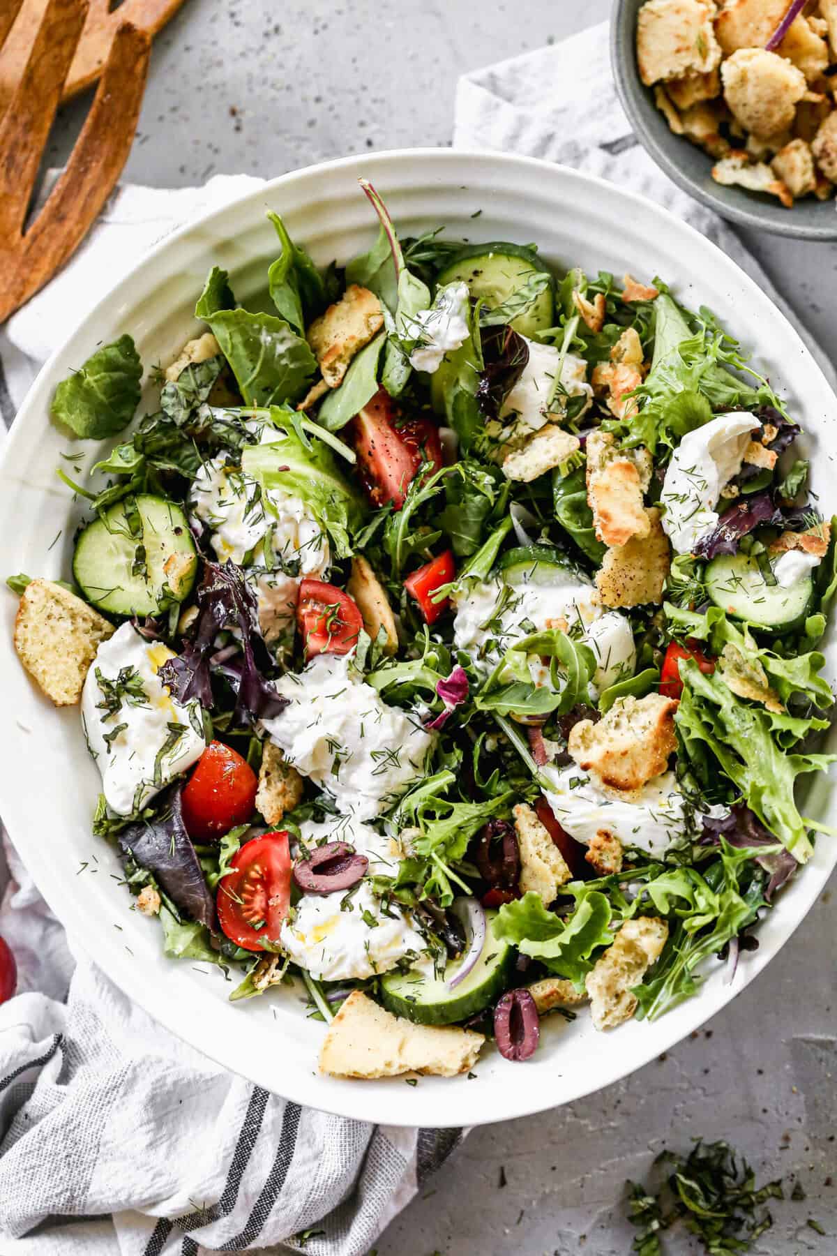 This Italian Grinder Chopped Salad is packed with salty deli meats, crisp chopped lettuce, tangy olives, and creamy cheese tossed in zesty dressing.