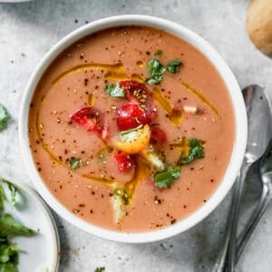A classic Gazpacho recipe is the most refreshing drink or soup of Summer! The flavorful vegetables really shine and it's so easy to make in the blender in just a few minutes!