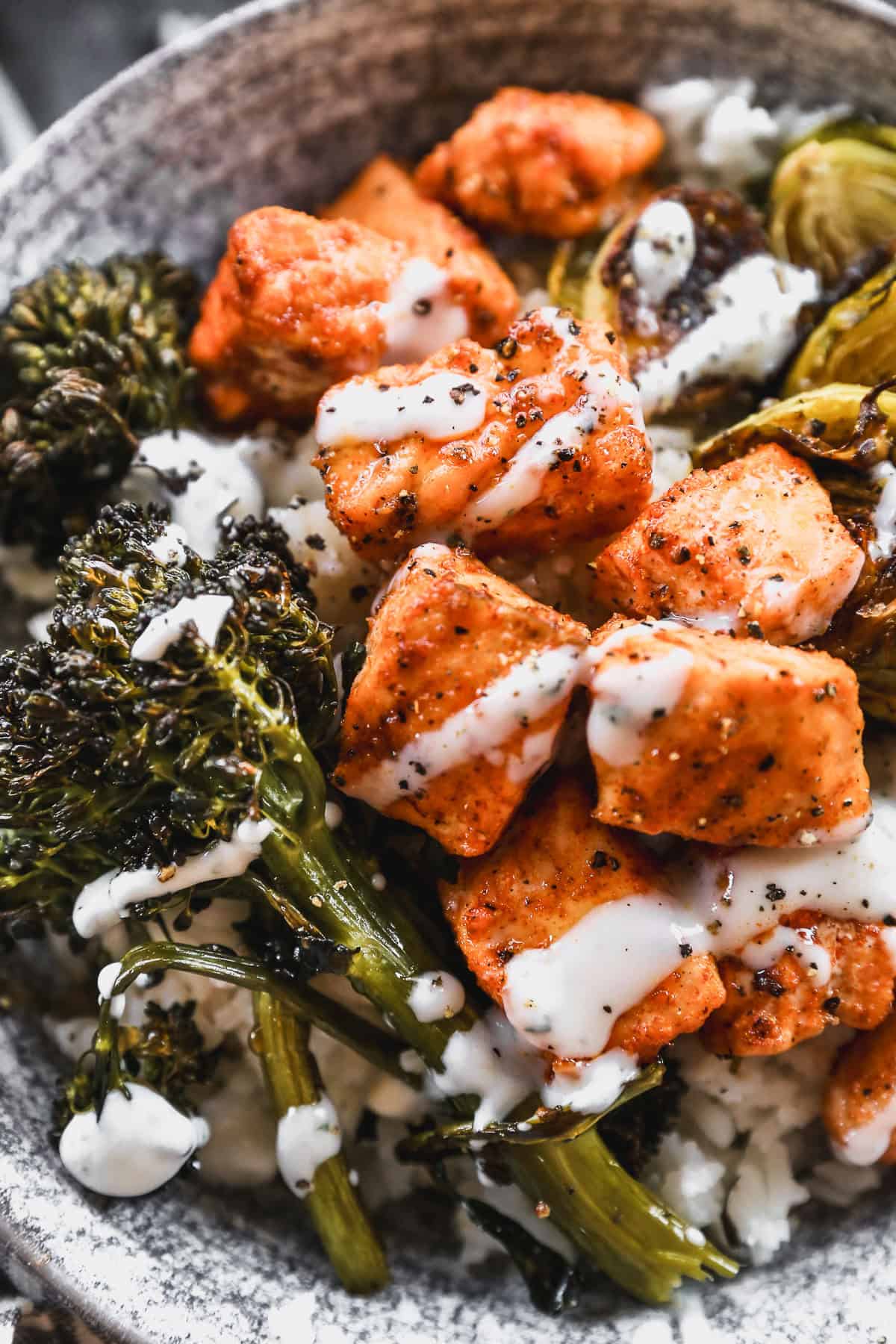 Roasted salmon with a hot honey drizzle and charred veggies over rice creates a bold, spicy-sweet dinner thatโs quick enough for weeknights and meal-prep ready.