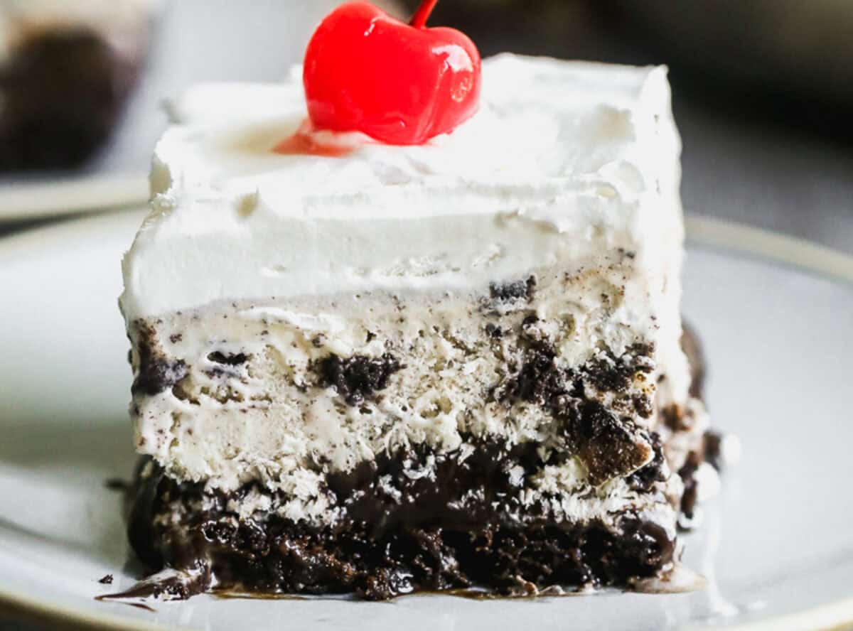 A piece of an easy Ice Cream Cake recipe served on a plate, the perfect summer dessert for potlucks or parties.