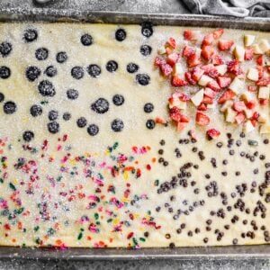 These sheet pan pancakes are baked all at once and divided into fun flavors like sprinkles, blueberries, chocolate chips, and fresh fruit. Perfect for feeding a crowd or picky eaters.