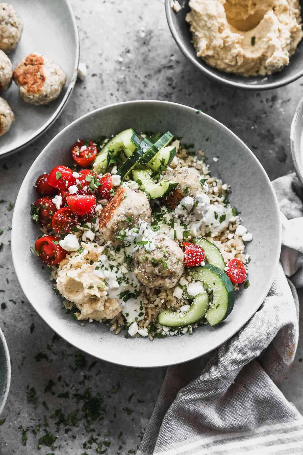 Juicy meatballs, crisp veggies, grains, and creamy tzatziki come together for a fresh, wholesome bowl thatโs perfect for busy weeknights or easy meal prep.