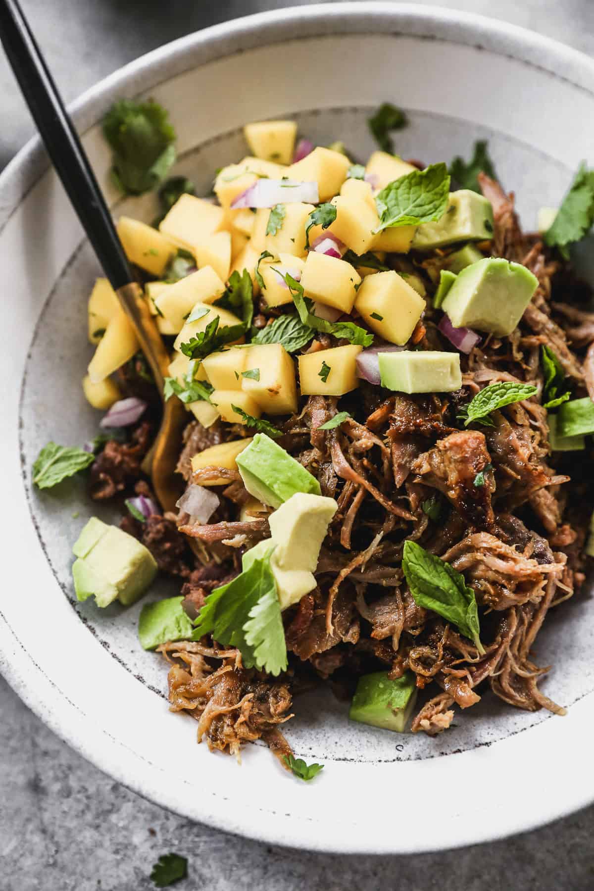 Juicy mojo pork, black beans, mango salsa, and creamy avocado come together in a bright, tropical bowl thatโs perfect for prepping ahead or enjoying on a warm evening.