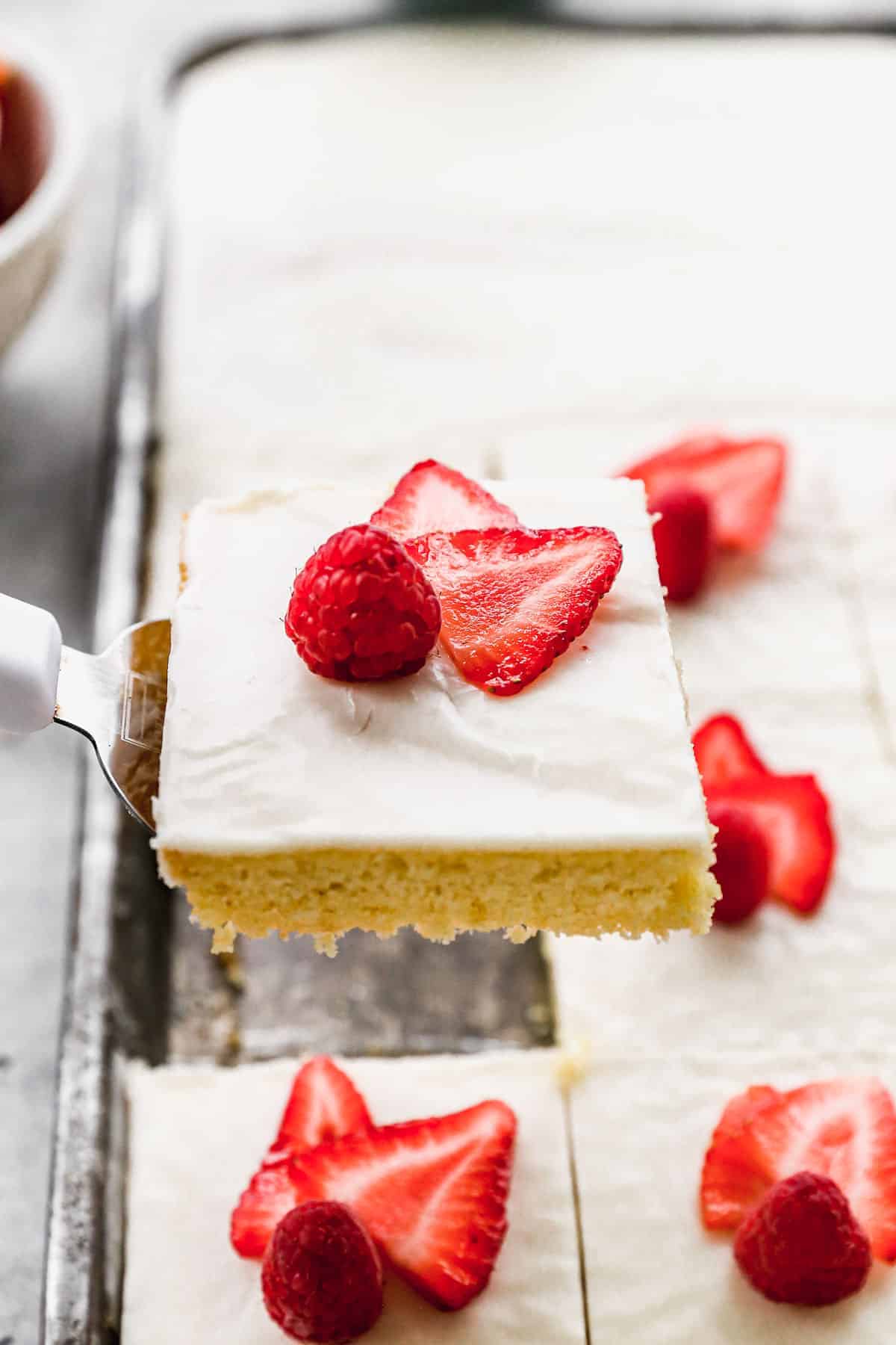 This soft and fluffy almond sheet cake is topped with a warm glaze and sliced almonds-perfect for potlucks when you need a crowd-pleasing dessert that’s easy to make ahead.