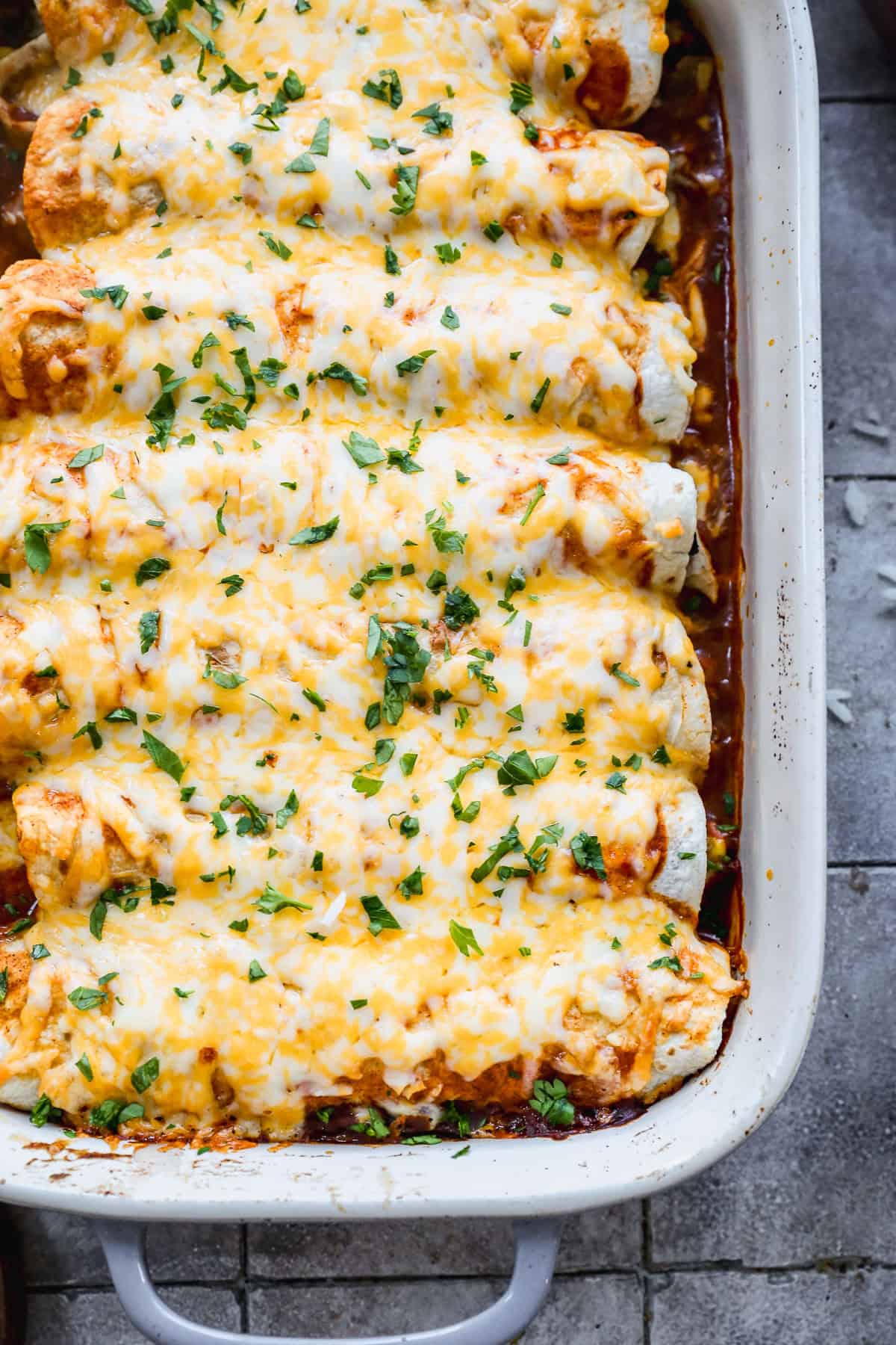 These saucy chicken enchiladas are even better with leftover rice folded into the filling.
