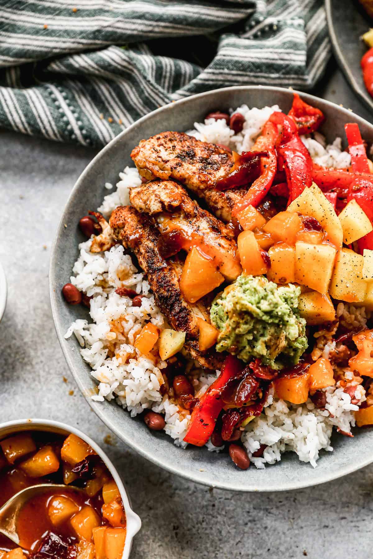 These jerk chicken bowls are a vibrant, spicy-sweet way to turn leftover rice into something special.