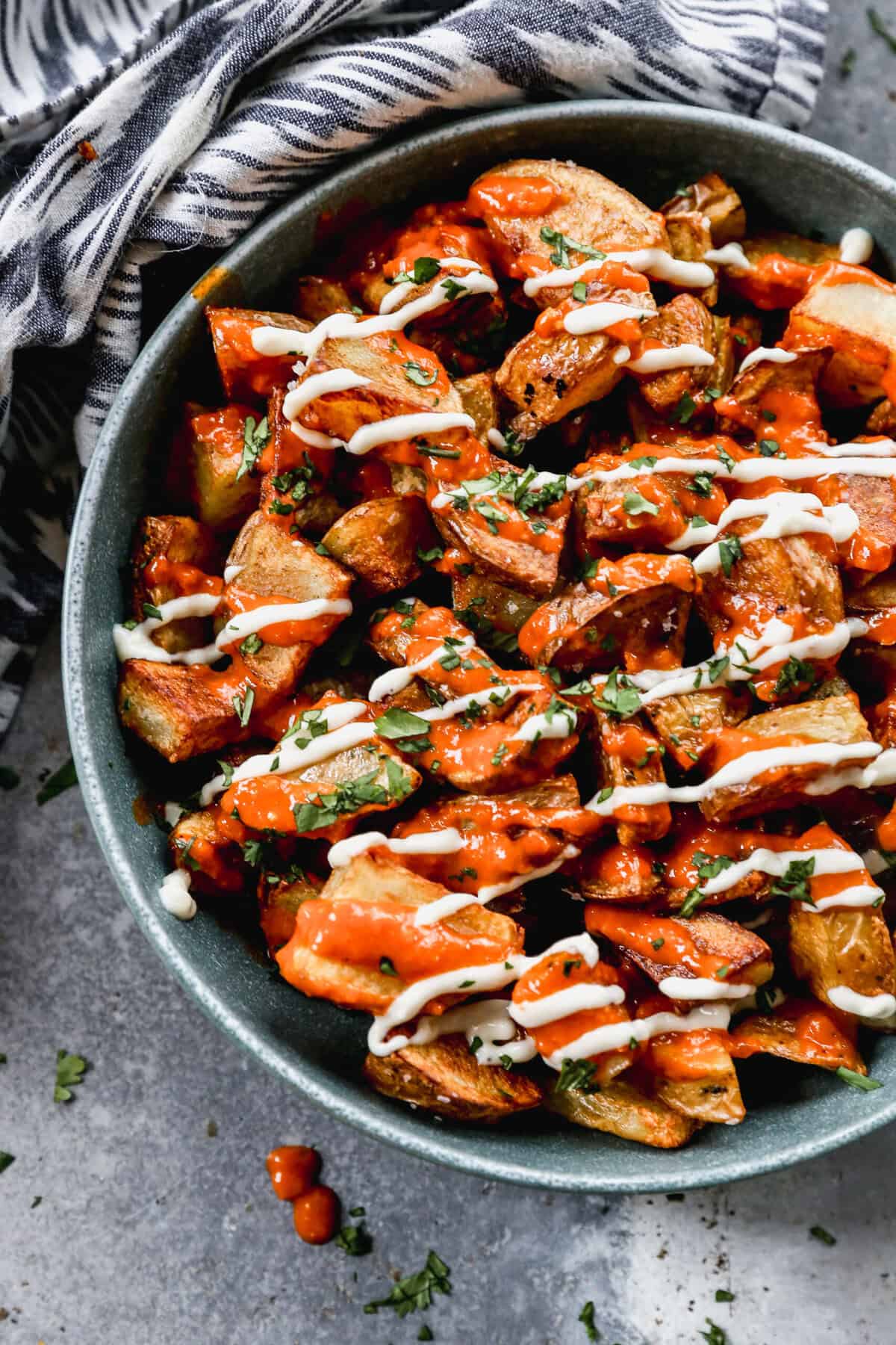 These crispy patatas bravas are tossed in a smoky, tangy sauce for a bold Spanish-inspired brunch side.