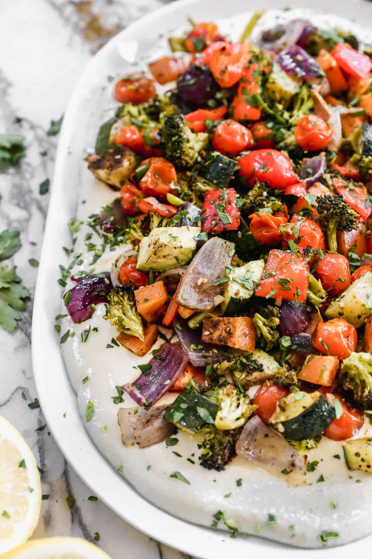 This whipped feta dip with roasted vegetables is a creamy and flavorful side or appetizer.