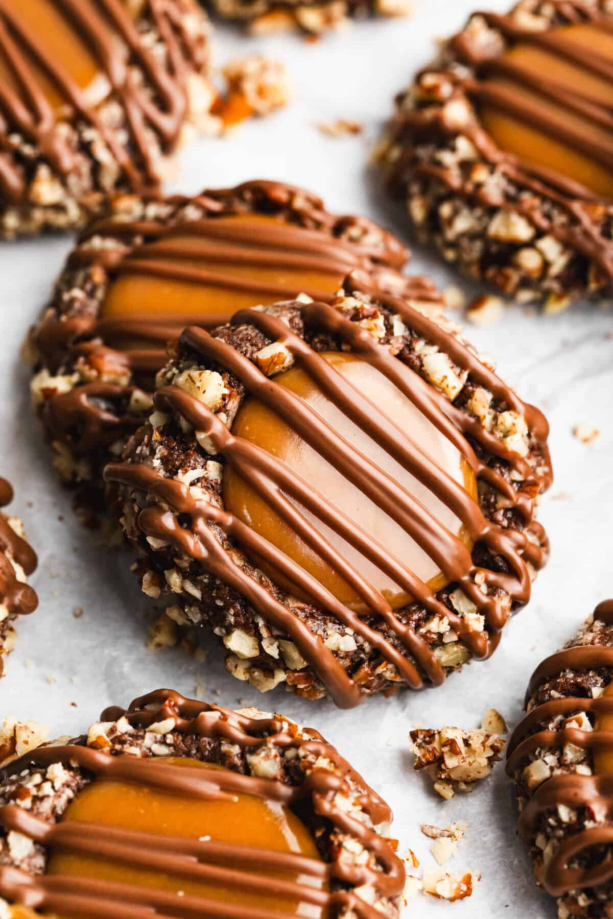 Turtle thumbprint cookies are a chocolate, caramel, and pecan treat that’s perfect for holiday trays or homemade gifts.
