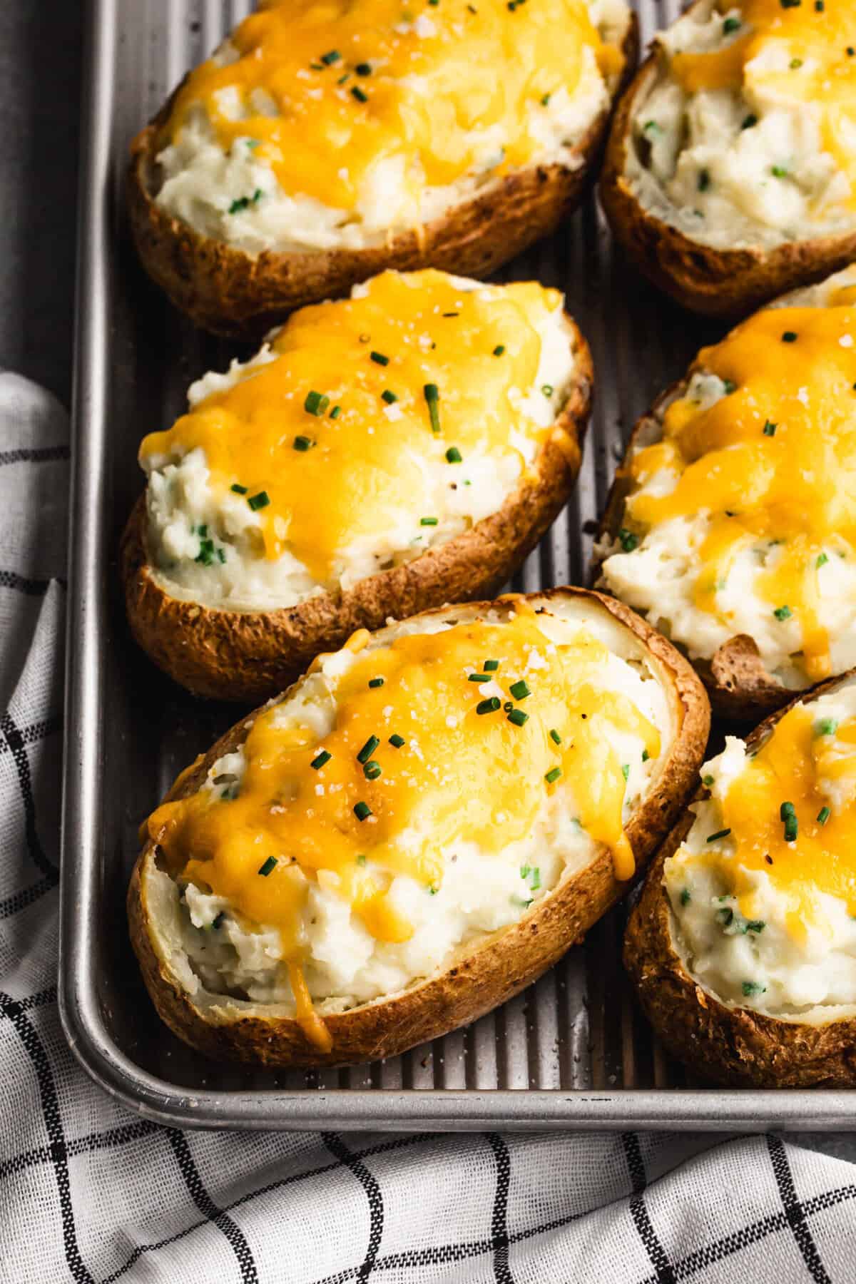 These twice baked potatoes are creamy, cheesy, and perfect for making ahead.
