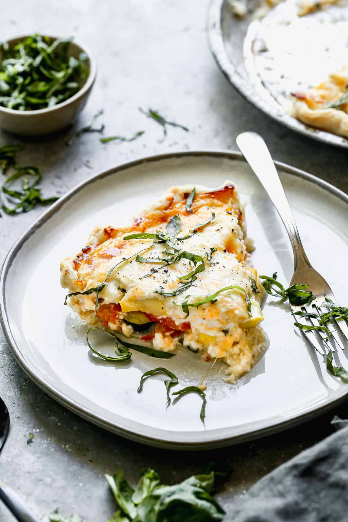 This savory vegetable pie is the perfect way to use up garden produce for a hearty weeknight meal.
