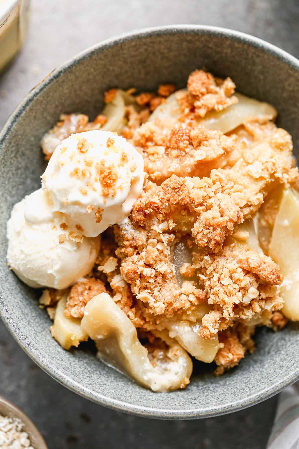 This Apple Crisp can be made in the oven or Instant Pot for a quick and cozy dessert topped with oat crumble.