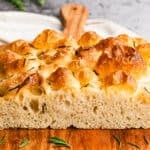 This homemade focaccia recipe is fluffy inside with crisp edges and can be topped with herbs, olives, or tomatoes for endless variations.