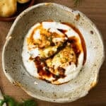 This easy Turkish Eggs recipe has perfectly poached eggs on a bed of lemon garlic yogurt, topped with a drizzle of a quick spiced chili butter.