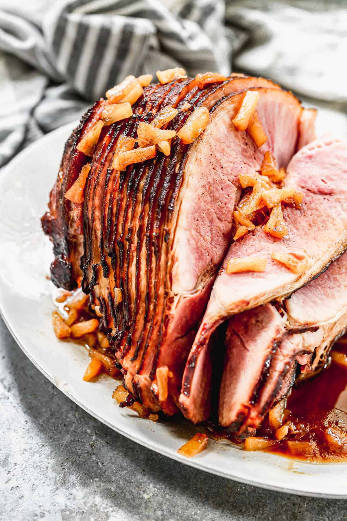 Baked ham is a classic and cost-effective holiday main that’s perfect for feeding a crowd on Thanksgiving.
