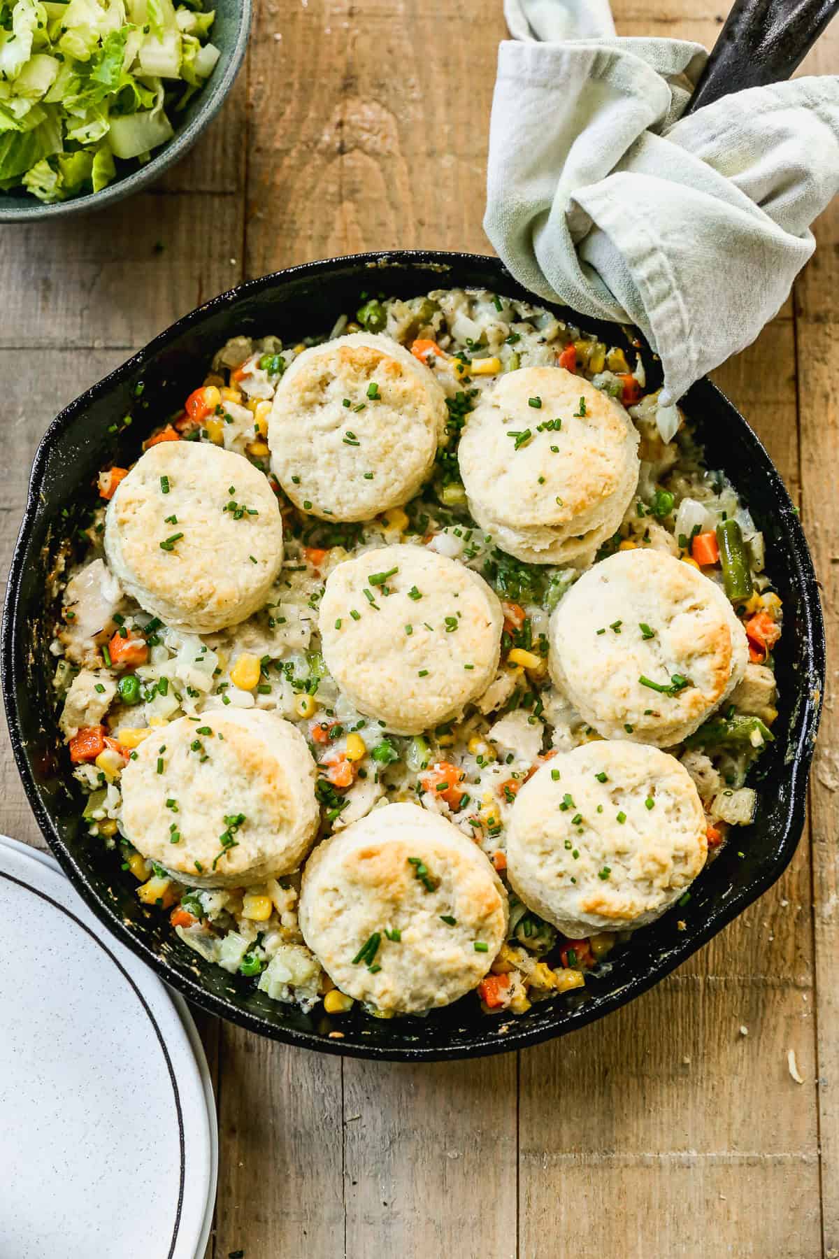 This Biscuit Chicken Pot Pie recipe delivers cozy, creamy dinner topped with buttery biscuits.