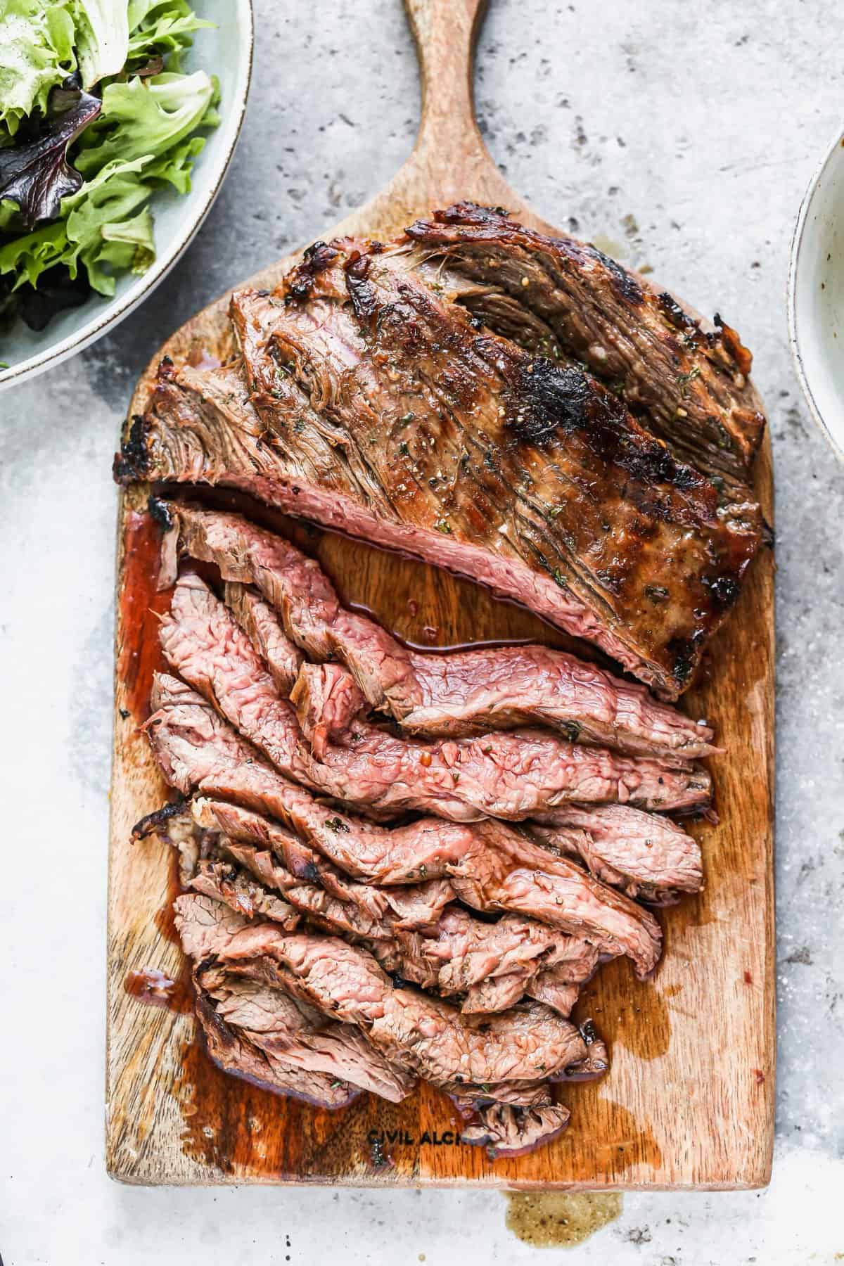 Marinated flank steak makes Thanksgiving simple with just 5 ingredients and quick grilling for a budget-friendly, flavorful feast.