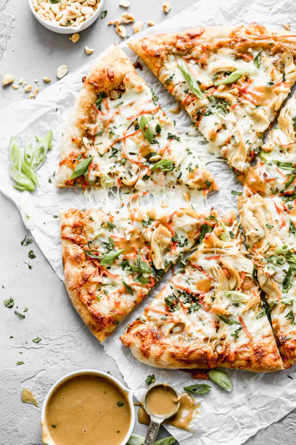 This Thai Chicken Pizza recipe gives a fun, flavor-forward twist to your usual pie.