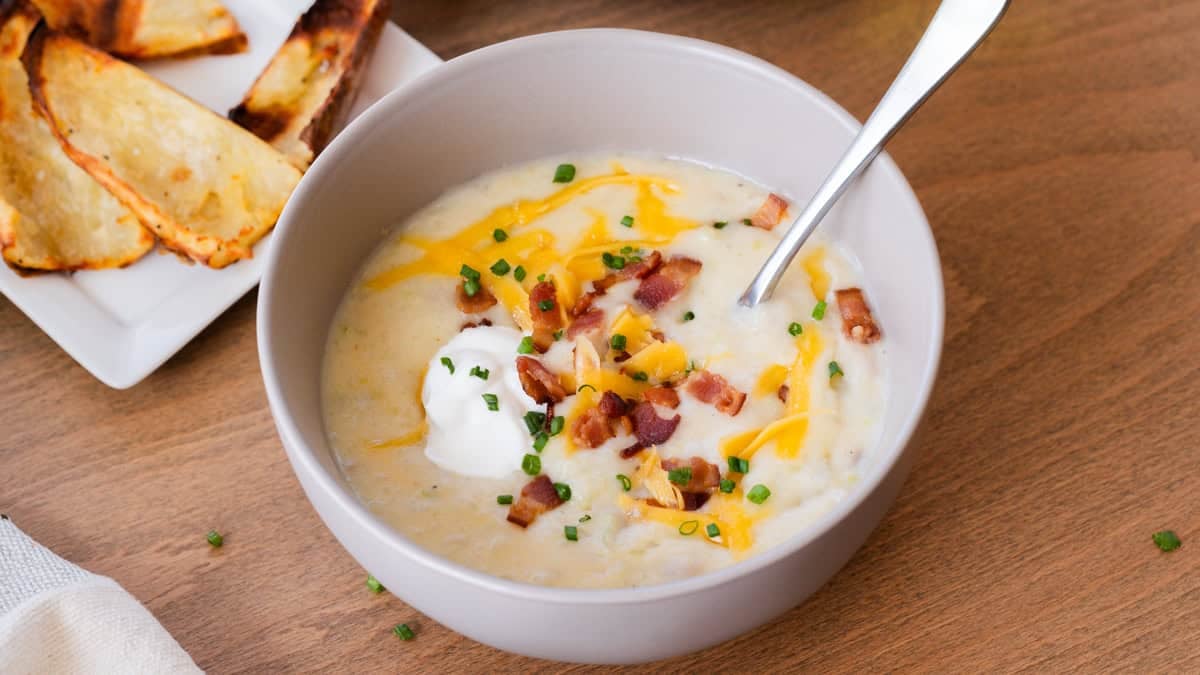 The best Baked Potato Soup recipe is creamy, flavorful, and topped with bacon, cheese, and sour cream. It's a kid-friendly soup that we enjoy all winter long!