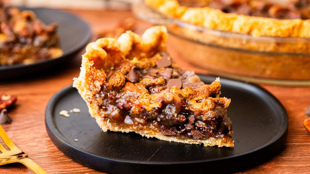 This easy Chocolate Pecan Pie recipe has that caramely custard filling we love, but with melted chocolate chips throughout. It's incredible and will become an absolute staple on your Thanksgiving table. 