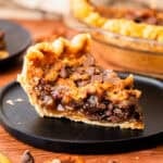 The Best Chocolate Pecan Pie has a rich gooey caramel-like filling with chocolate chips and buttery pecans inside a flaky homemade pie crust.