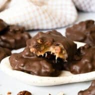 Homemade chocolate turtles are easier and quicker than you think! We make a simple and delicious microwave caramel then stir in chopped pecans and dip in chocolate. Everyone loves them!
