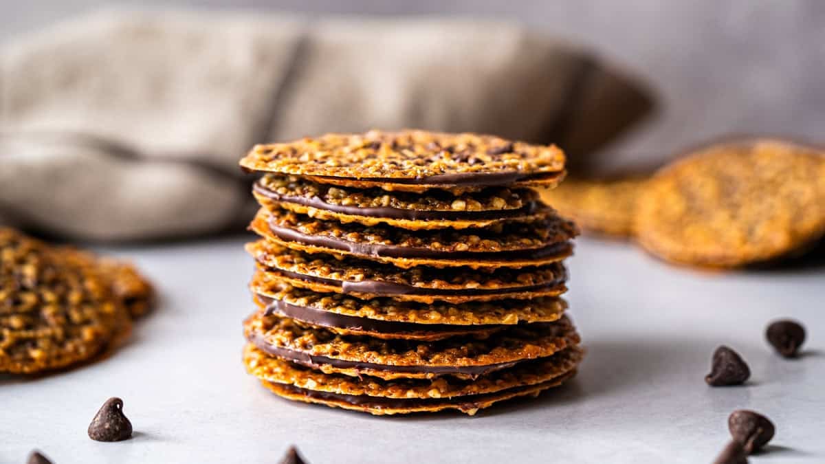 This easy Lace Cookies recipe is thin and delicate with a layer of chocolate in between. They are irresistible!