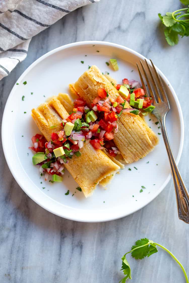 Tamales bring bold flavor to your holiday meal and can be made ahead for easy serving.
