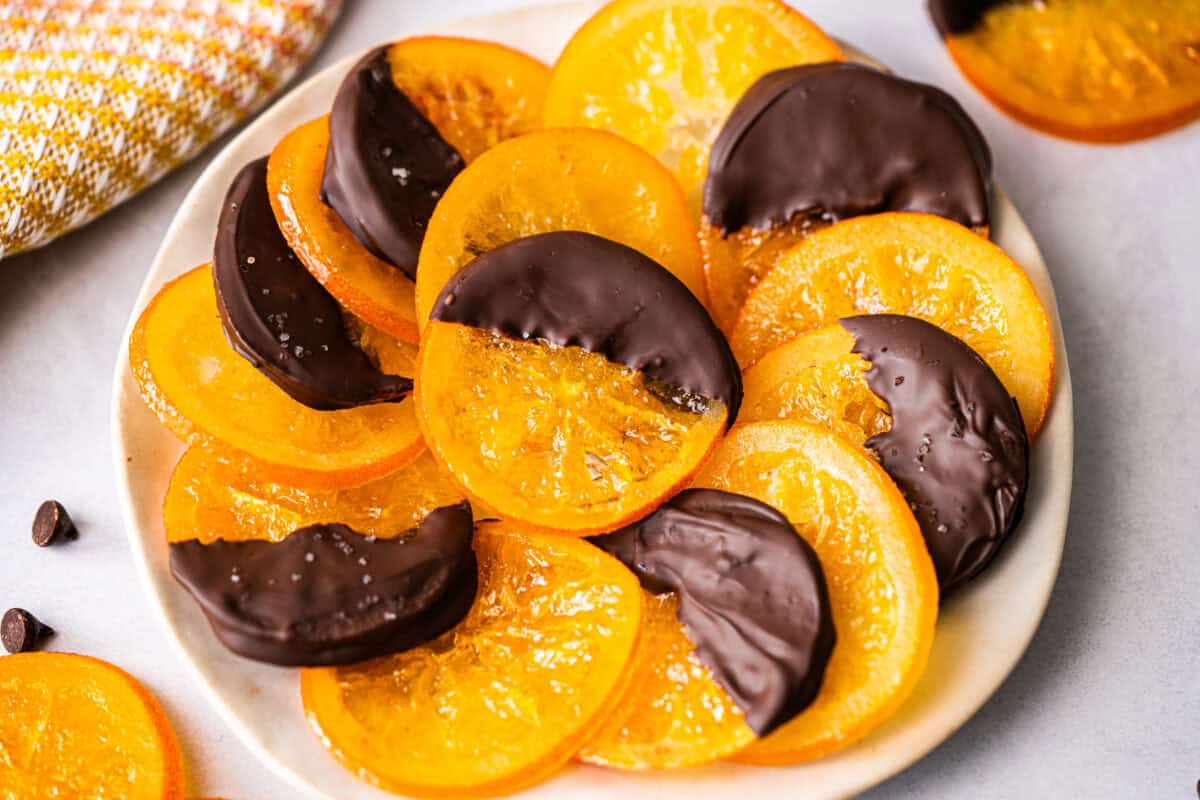 Candied Orange Slices are such a delicious treat that you can dip in chocolate or leave plain. They simmer in sugar and water then dry to develop that perfect sweet, chewy texture.