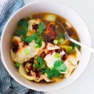 This Chinese Dumpling soup recipe has mini dumplings in a delicious vegetable broth and topped with chili crisp. It's flavorful, comforting, and delicious!