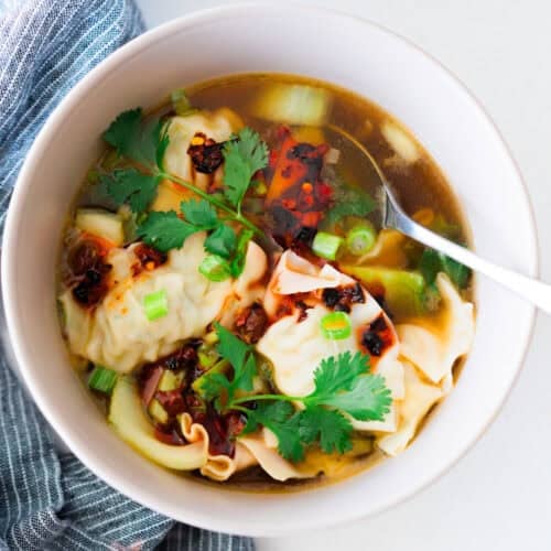 This Chinese Dumpling soup recipe has mini dumplings in a delicious vegetable broth and topped with chili crisp. It's flavorful, comforting, and delicious!