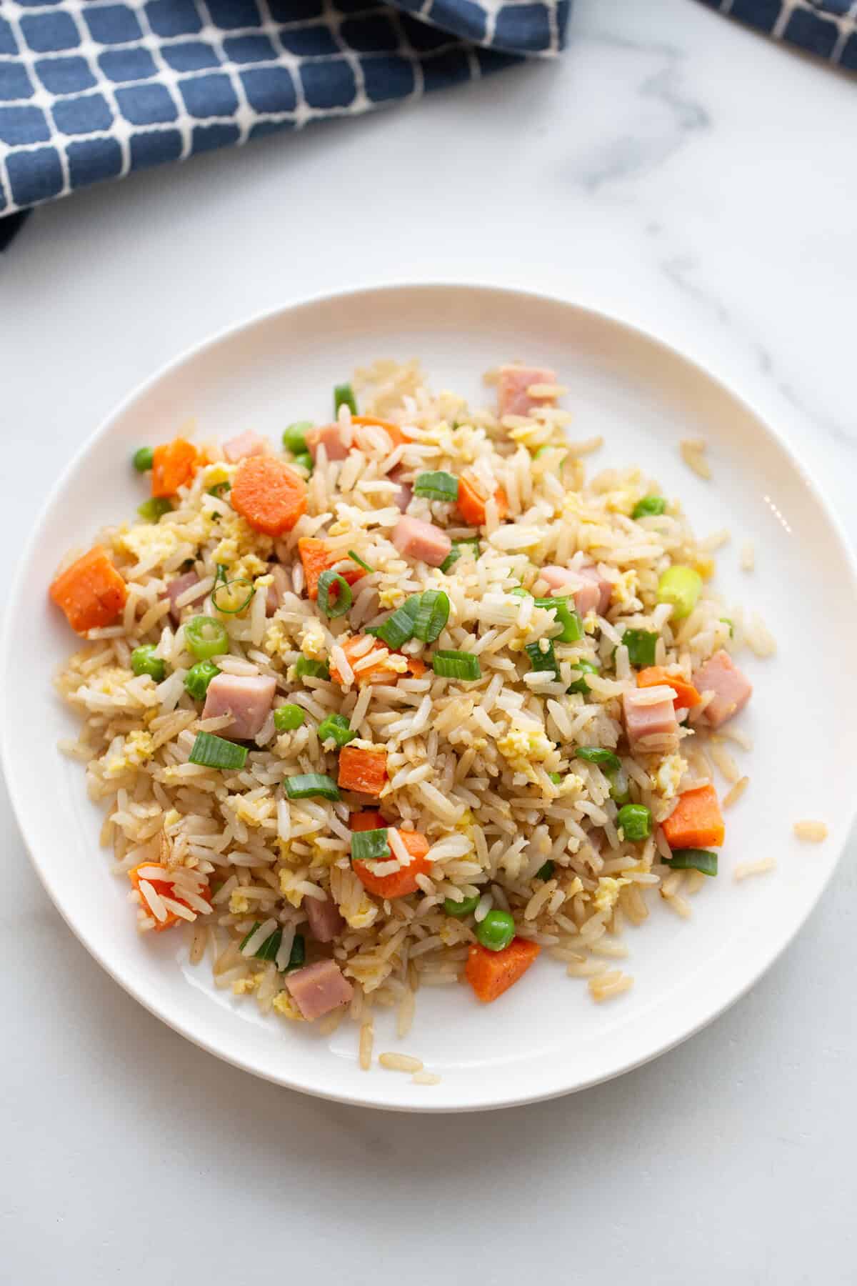 Ham fried rice is a fast, family-friendly dinner that uses up leftover ham and veggies.