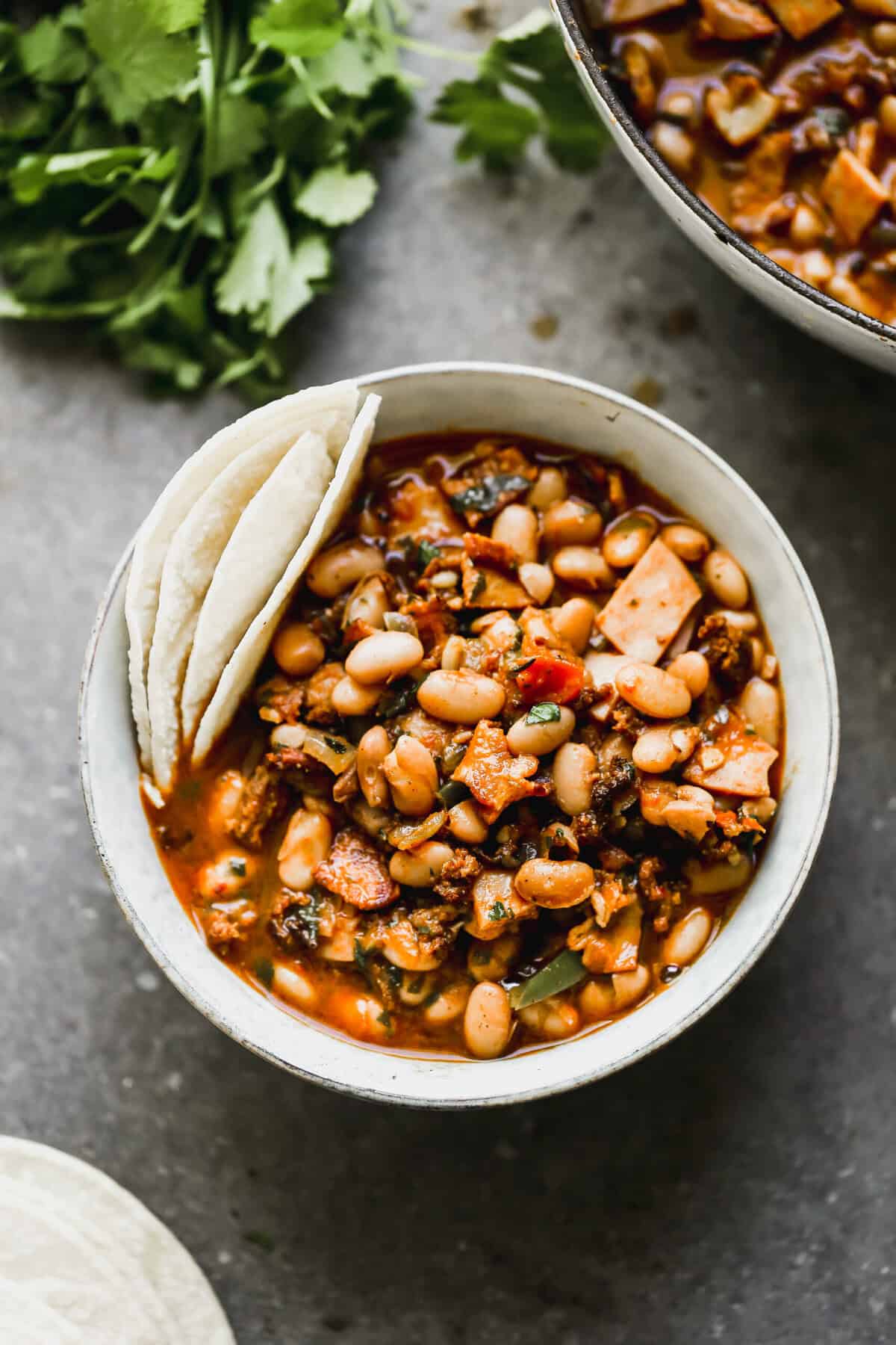 This charro beans recipe creates a rich, affordable dish dinner to serve over rice or alongside tacos or rice.
