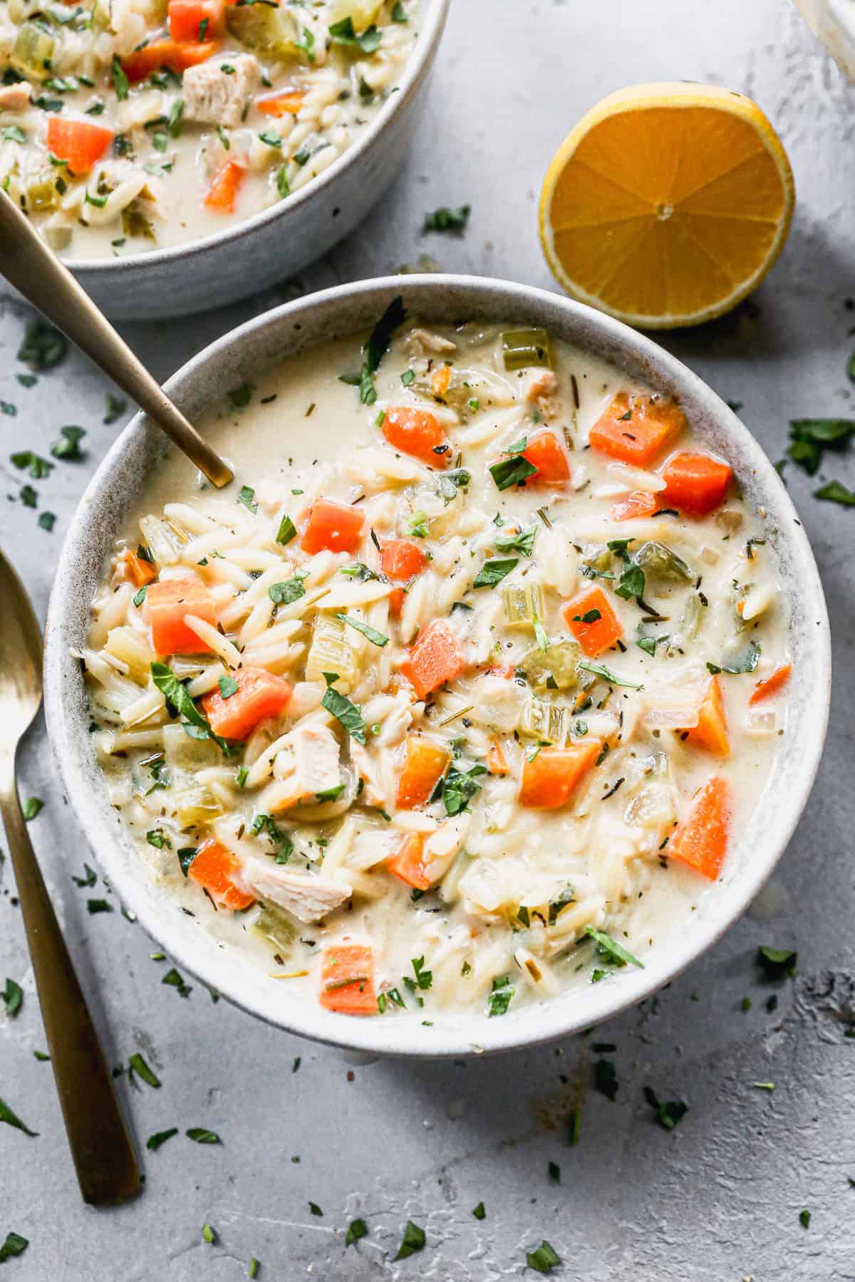 A lemon chicken orzo soup recipe that soothes with bright citrus and hearty ingredients.