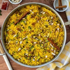 This easy Yellow Rice recipe is fluffy, flavorful, and goes with practically any main dish! Whip it up in 30-minutes with pantry staples and no special equipment required!