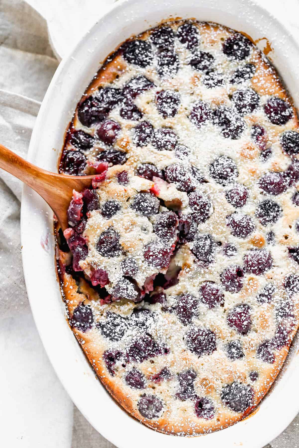 Cherry Clafoutis is a simple baked custard that works with fresh or frozen cherries.
