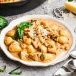 This 30-minute Creamy Chicken and Gnocchi recipe is made in one pan with a creamy parmesan sauce made from scratch. It's a comforting meal that looks impressive but couldn't be easier!