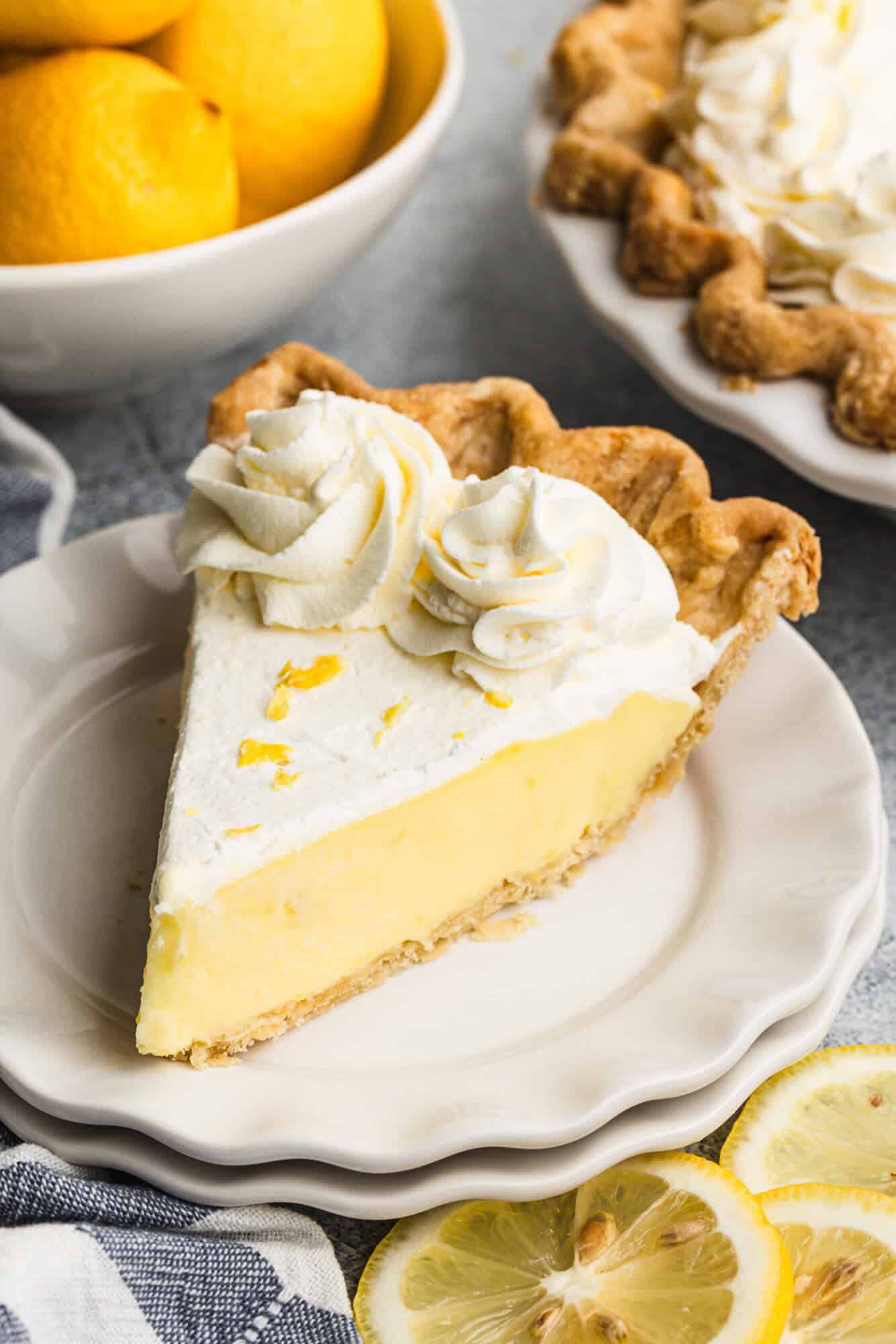 Lemon Cream Pie is a bright, fluffy dessert that feels refreshing and perfect for a Pi Day party.