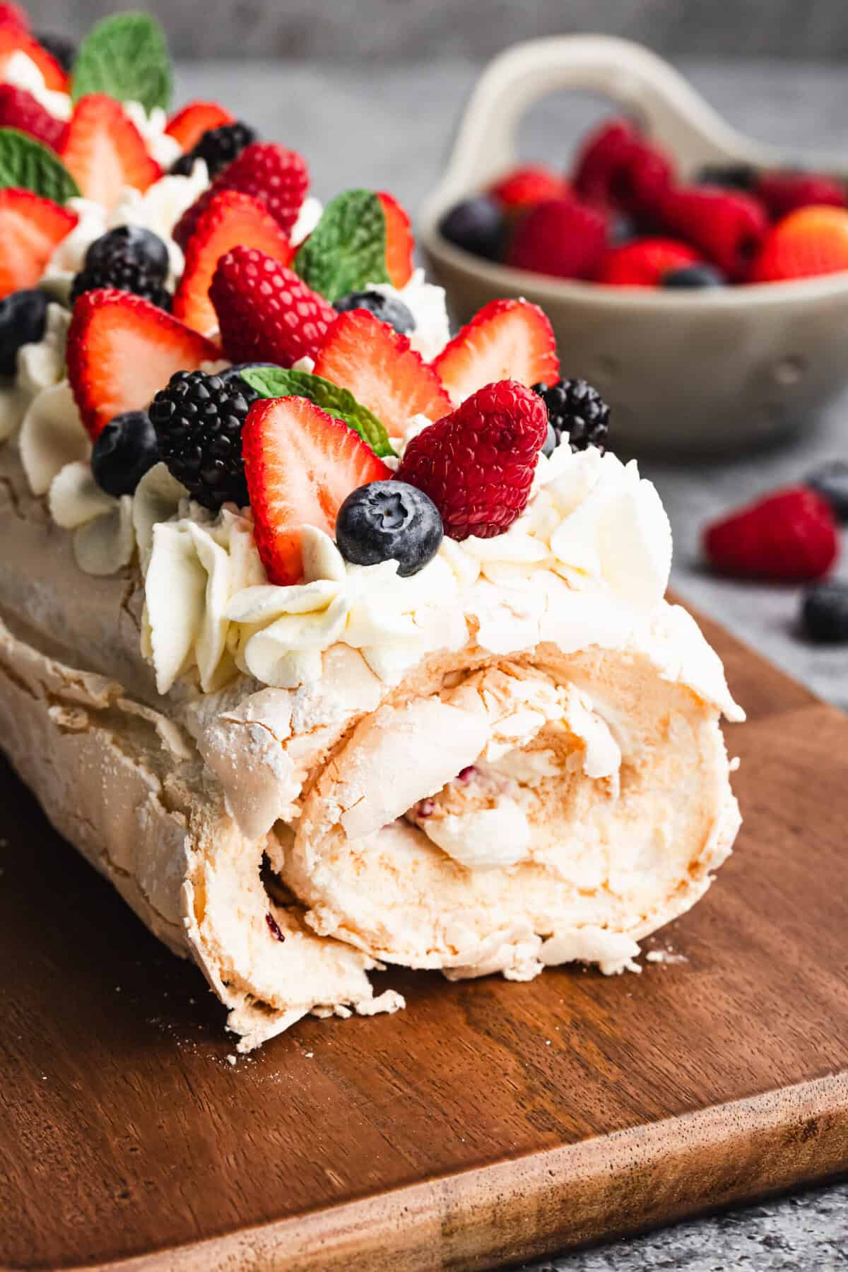 Meringue Roulade is a make-ahead dessert filled with fruit and cream for a light but impressive finish.