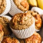 This high protein banana muffins recipe is healthy and packed with oats, bananas, greek yogurt, protein powder, and sweetened with maple syrup. They are moist, fluffy, and keep you full longer!