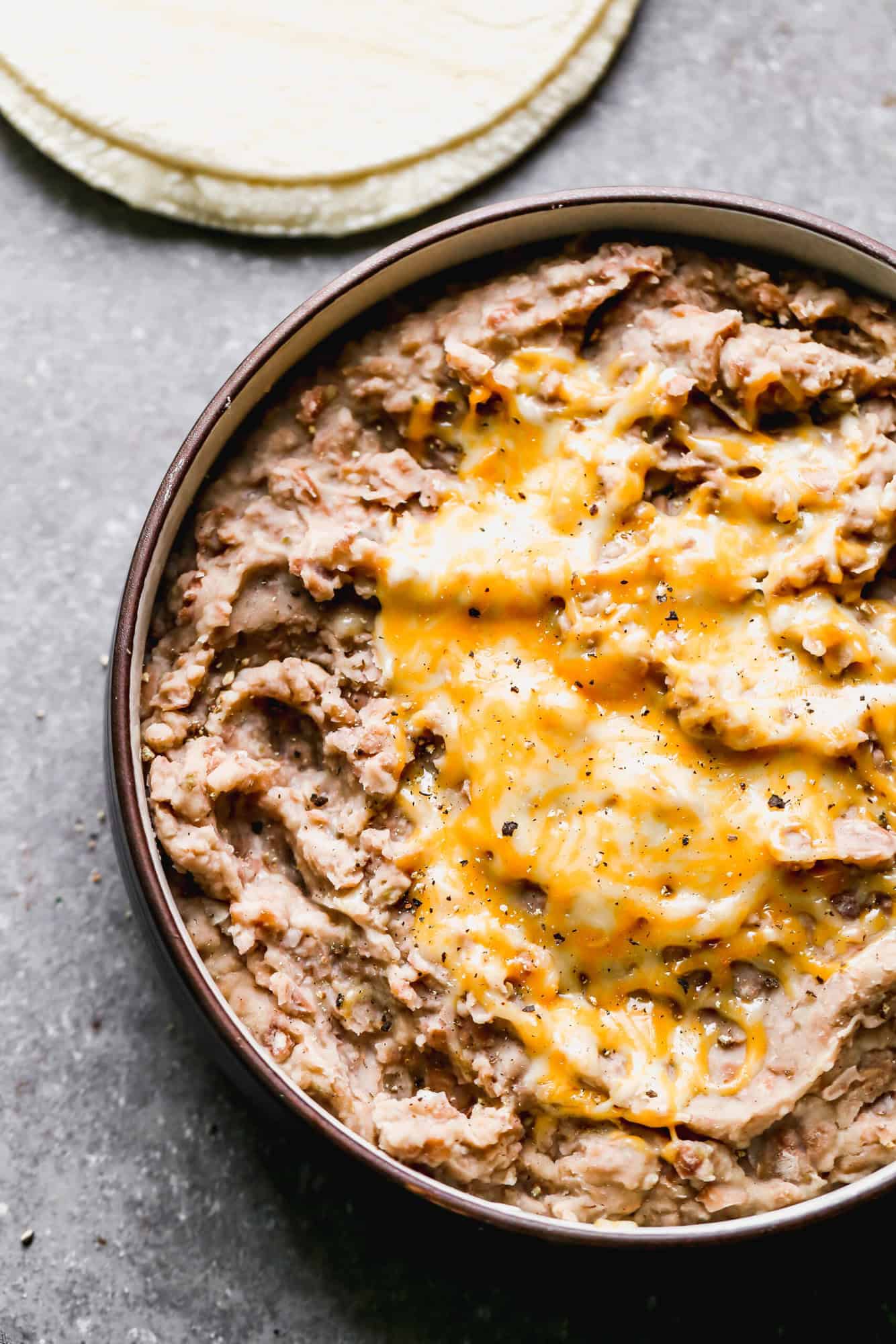 Homemade Refried Beans are a simple, budget-friendly staple that make tacos, burrito bowls, and side dishes taste even better.